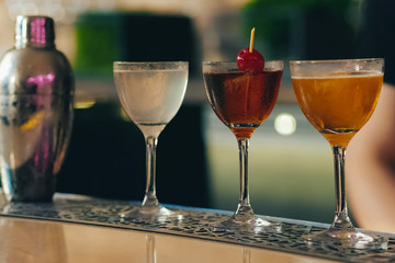 Bartender pouring cocktail at bar counter