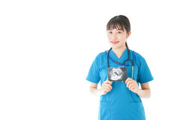 妊婦のエコー画像と笑顔の若いナース