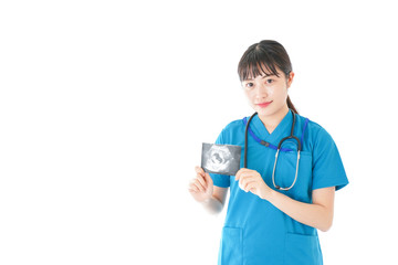 妊婦のエコー画像と笑顔の若いナース