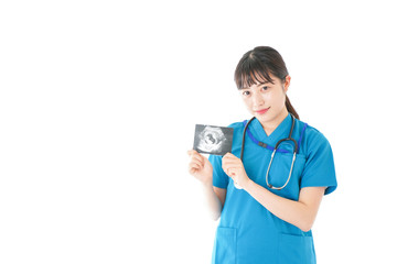 妊婦のエコー画像と笑顔の若いナース