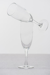 Champagne glasses on tablecloth isolated on grey