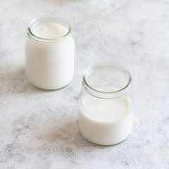 Fermented drink kefir in small bottles and kefir grains
