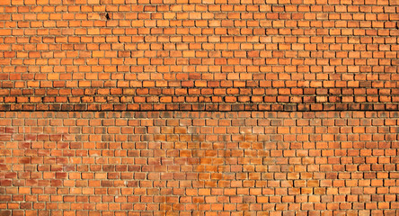 Single damaged brick in red old brick wall 