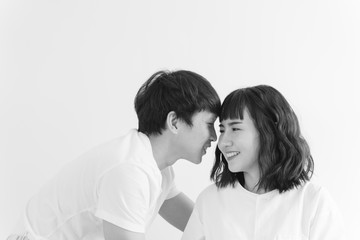 Sweet young asian couple falling in love. Love, valentine and wedding concept.