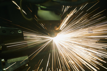 Laser cutting. Metal machining with sparks