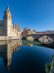 Ria de Bilbao with the church of San Anton, in the seven streets, old town, in the Basque country.