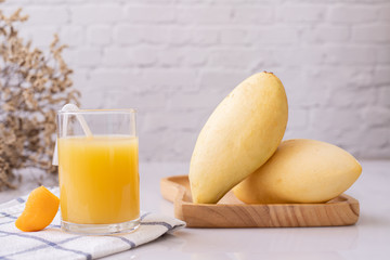Glass of mangoes juice on table, Sweet dessert.