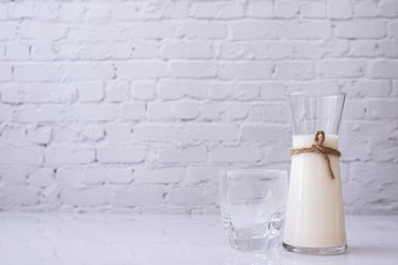 bottle of fresh  milk on white table.