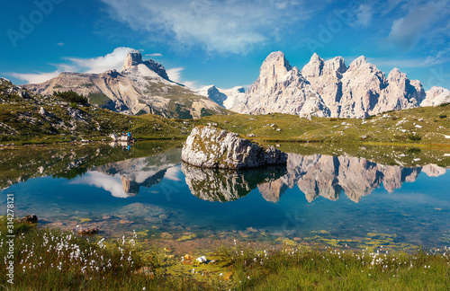 Beautiful mountain Scenery in Dolomites mountains by Tre Cime di Lavaredo national park. Fantastic lake with mountains peaks  reflected. Wondeful Nature Landscape. Picture of wild area of Italy.
