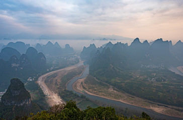 The mountains and river in the fog in Yangshuo, China