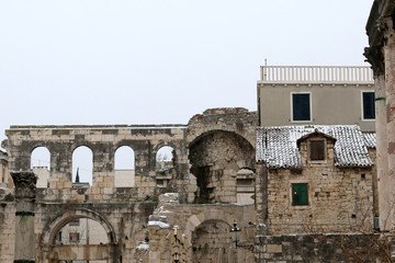 Historical and traditional architecture in Split, Croatia, covered in snow. Selective focus.
