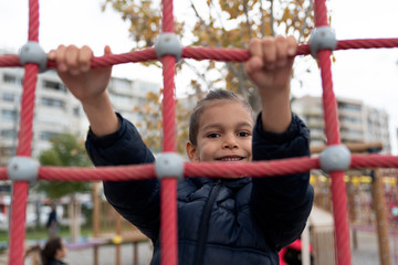 Obraz premium Kid playing at the playground