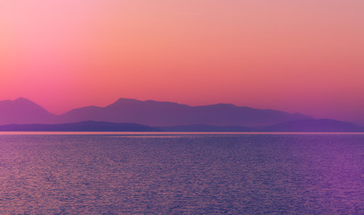 Fantastic seascape with colorful sky during sunset. nature in twilight period during sunset over the sea and the nice mountains silhouette. Fantastic nature background