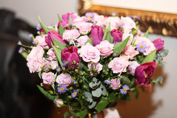 Beautiful background of flowers, roses and tulips. Gold decorated frame. Greeting card, decoration for party. Holiday concept. Stock photo. Calendar