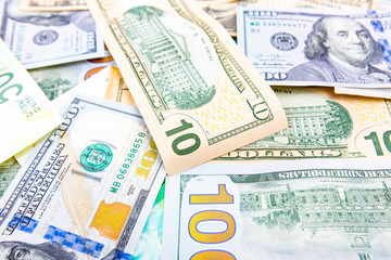 A pile of  US banknotes with president portraits. Cash of  dollar bills, dollar background image