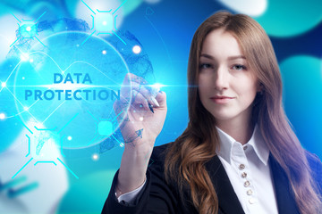 Business, Technology, Internet and network concept. Young businessman working on a virtual screen of the future and sees the inscription: Data protection