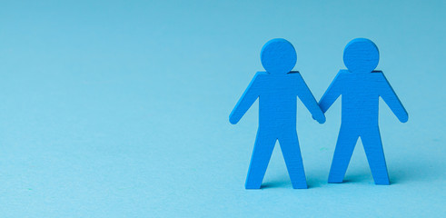 Two GAY men holding hands. On a blue background