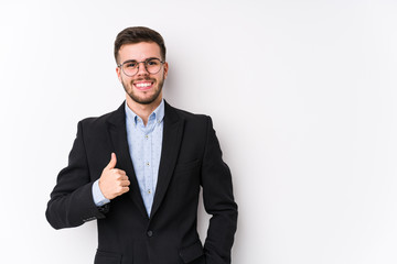 Young caucasian business man posing in a white background isolated Young caucasian business man smiling and raising thumb up