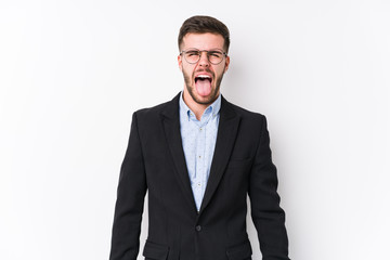 Young caucasian business man posing in a white background isolated Young caucasian business man funny and friendly sticking out tongue.