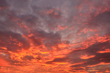 dramatic cloudy sky in the rays of setting sun