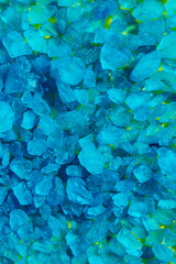 Blurred vertical abstract blue texture background. Blurry blue sea salt texture. Colorful background.