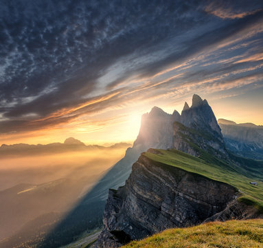 Majestic Odle group peaks on Dolomite Alps During Sunset. Unsurpassed Landscape of Dolomites Mountains with colorful Sky, under Sunlit. popular travel and hiking destination. Colorful summer sunrise.