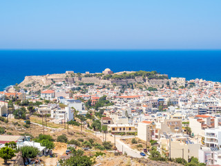 Fototapeta na wymiar Crete island, Greece - Panorama of Rethymnon, Crete, Greece and The Venetian fortress Fortezza. It is the citadel of the city of Rethymno built by the Venetians in the 16th century.