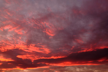 dramatic cloudy sky in the rays of setting sun