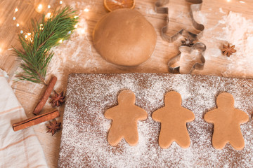 Gingerbread man cookies for Christmas holiday. process of manufacturing . close-up, space for text