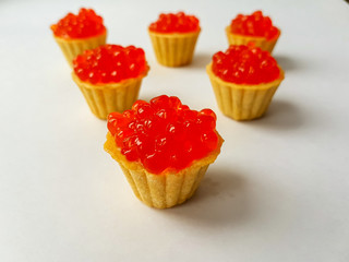 Tartlets with red salmon caviar. Snack, delicacy