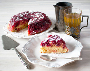 Cranberry tart pie cake piece, plate, spoon, coffeepot, tea glass, cup holder, spatula, white table
