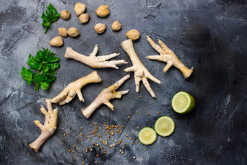 Chicken legs with lemon sliced and herb .top view
