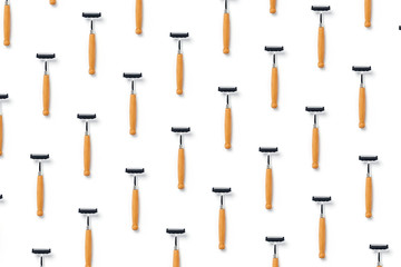Zero waste concept. Group of razors with wooden handles on isolated white background. Flat lay, top view, copy space.
