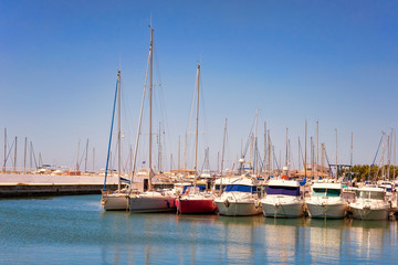 Yachts on the sea pier on a warm summer day.