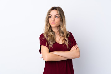 Fototapeta premium Young woman over isolated white background portrait