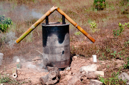 Burn charcoal by using an oil tank.