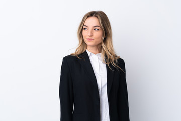 Obraz premium Young business woman over isolated white background standing and looking to the side