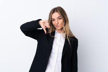 Young business woman over isolated white background showing thumb down sign