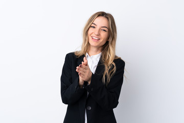 Young business woman over isolated white background applauding
