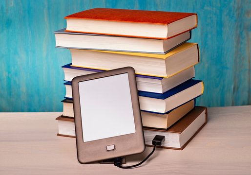 e-book reader and book stacks