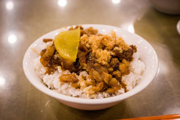 Lo bah png, traditional Taiwanese rice dish (minced pork rice) on the table in restaurant. Lo bah png is a type of gaifan dish that is commonly seen throughout Taiwan and Southern Fujian.