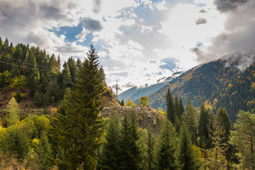 Mountain  slopes covered with forests and low thunderclouds in Svaneti in the mountainous part of Georgia