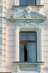 Exquisite window with white fretwork, old restored building in historic center of Odessa, Ukraine