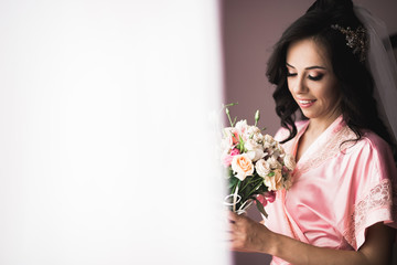 Bride holding big and beautiful wedding bouquet with flowers