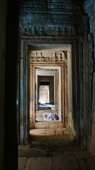 Stone rock door interior decoration in Bayon Temple in Angkor wat complex, Siem Reap Cambodia