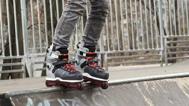 Aggressive skating on the mini ramp at the skatepark