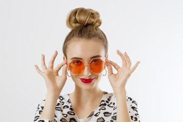 Close-up woman face. Fashion female closeup in trendy clothes isolated on white background. Summer fun time and summertime accessories. Funny girl.