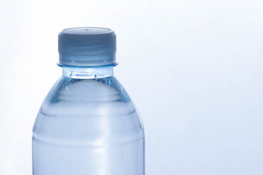 Closeup image of the lid of plastic water bottles