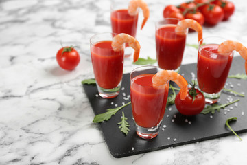 Shrimp cocktail with tomato sauce served on marble table