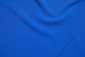 Crumpled fabric, top view. Color of the year 2020 (Classic blue)
